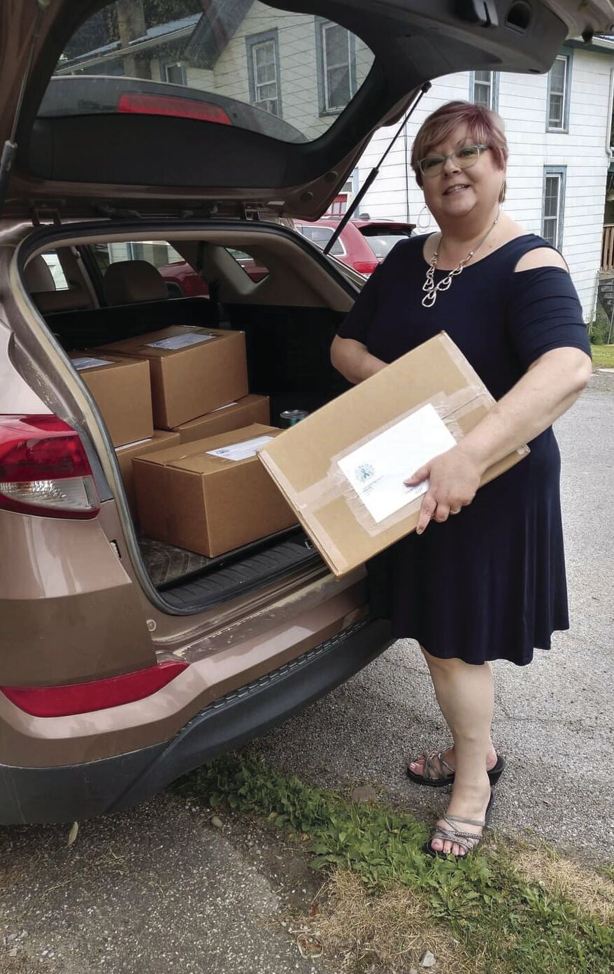 Jennifer Howe taking packages of comfort bags to the post office!